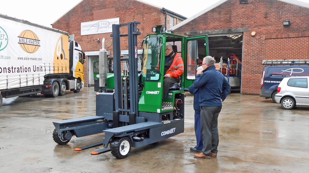 Staff at Armstrong Priestley inspect their new Combilift C3000