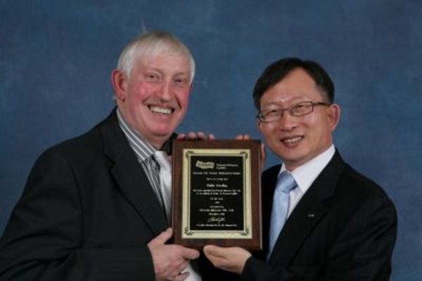 Roger Hardman, Ability Handling's globe trotting MD, collects the Official Authorised Doosan Forklift Dealer 2011 plaque after attending the IMHX show at Birmingham NEC 2010.